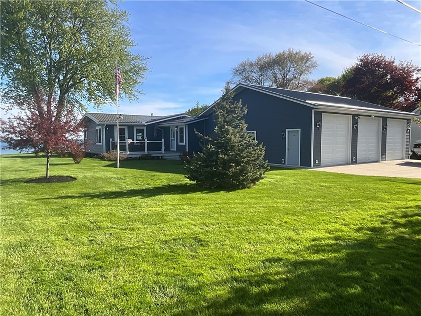 Enjoy luxury year-round living in this beautifully landscaped - Beach Home for sale in Waterport, New York on Beachhouse.com