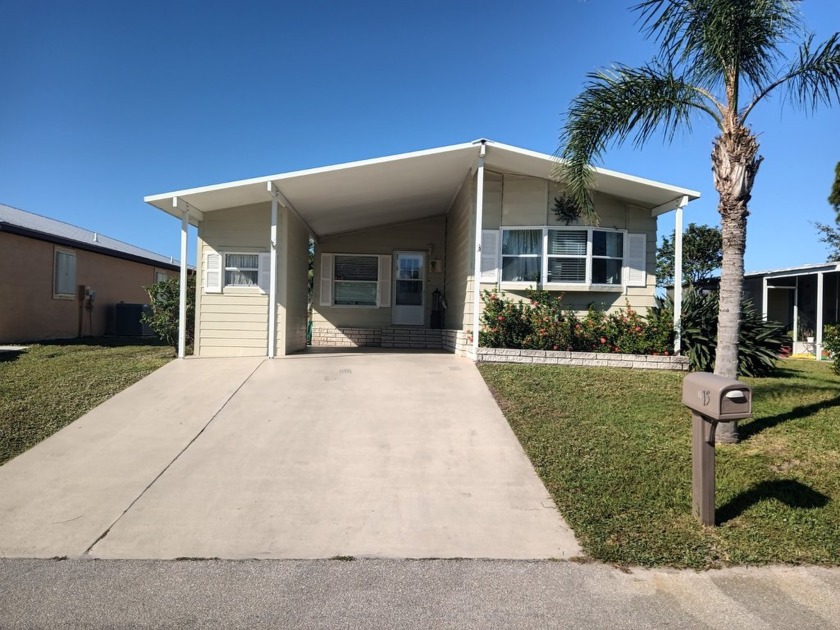 This spacious offset double-wide home can fulfill your dreams of - Beach Home for sale in Fort Pierce, Florida on Beachhouse.com