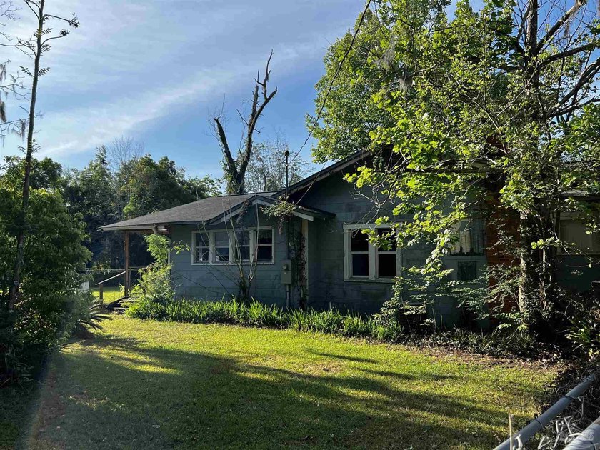 1-Acre Estate with Private Creek Frontage Experience the rare - Beach Home for sale in Milton, Florida on Beachhouse.com