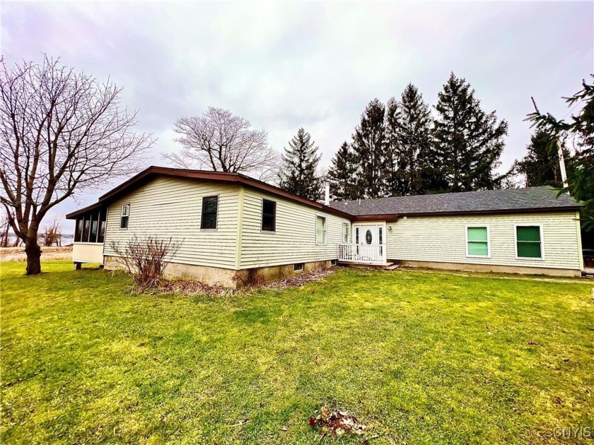 Welcome to your WATERFRONT oasis in Sackets Harbor. This open - Beach Home for sale in Hounsfield, New York on Beachhouse.com