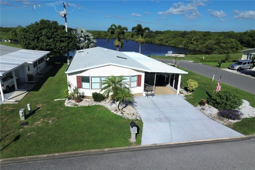 Welcome to your lakeside sanctuary!! This charming, manufactured - Beach Home for sale in Barefoot Bay, Florida on Beachhouse.com