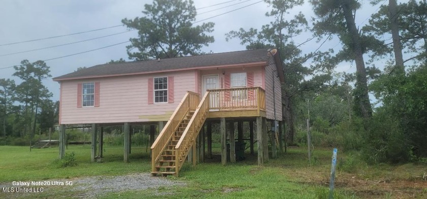 Price reduced to $139,9000.  Smaller waterfront home on a quiet - Beach Home for sale in Bay Saint Louis, Mississippi on Beachhouse.com