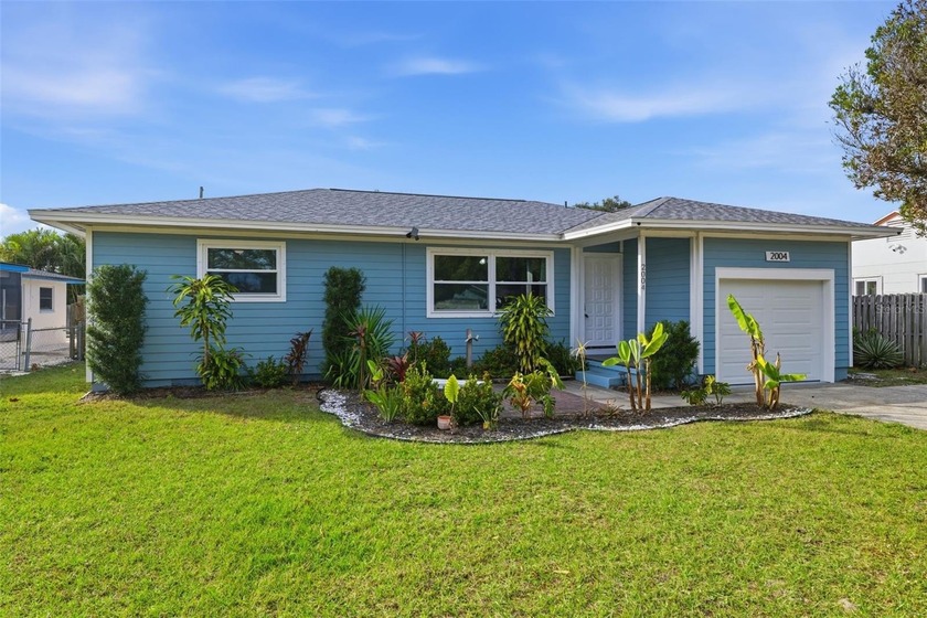 This beautifully maintained three-bedroom, two-bath home with a - Beach Home for sale in Dunedin, Florida on Beachhouse.com