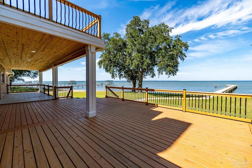 Experience true waterfront living in Gulf Breeze in this - Beach Home for sale in Gulf Breeze, Florida on Beachhouse.com