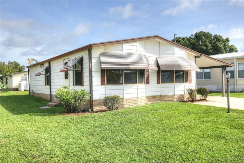 Completely furnished with open floor plan, allowing for seamless - Beach Home for sale in Barefoot Bay, Florida on Beachhouse.com