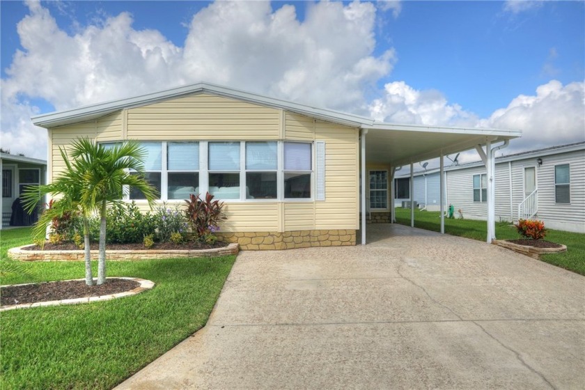 Attractive island kitchen model features 4* vinyl siding & metal - Beach Home for sale in Barefoot Bay, Florida on Beachhouse.com