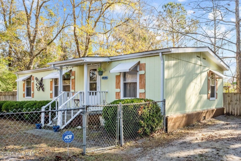 Welcome to your coastal retreat! Nestled on a secluded tree - Beach Home for sale in Sneads Ferry, North Carolina on Beachhouse.com