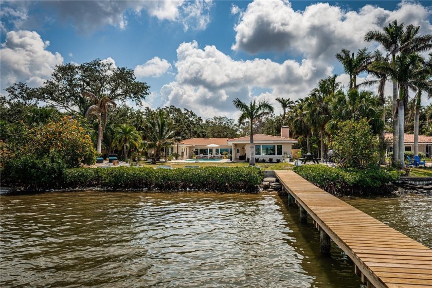 Discover the essence of waterfront luxury in the coveted Jungle - Beach Home for sale in St. Petersburg, Florida on Beachhouse.com
