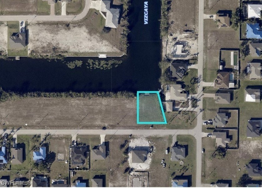 Big time views down intersecting canals. Seawall and concrete - Beach Lot for sale in Cape Coral, Florida on Beachhouse.com