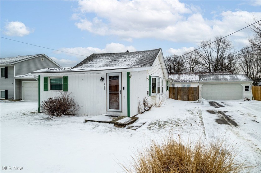 This beautifully renovated two-bedroom ranch cottage offers - Beach Home for sale in Sheffield Lake, Ohio on Beachhouse.com