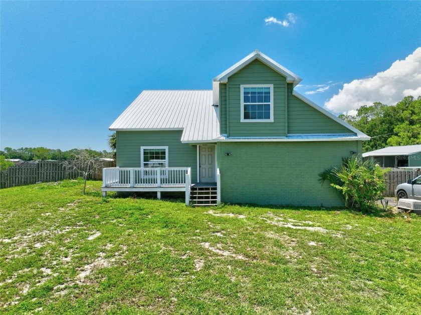 An equestrian's dream come true! This cozy two-story home offers - Beach Home for sale in New Smyrna Beach, Florida on Beachhouse.com