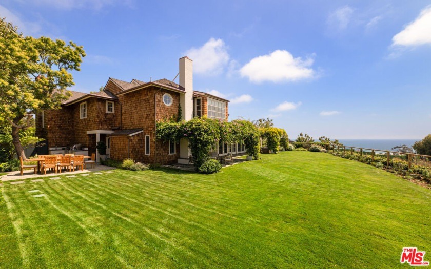 Situated behind gates this traditional East Coast shingled home - Beach Home for sale in Pacific Palisades, California on Beachhouse.com