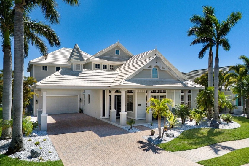 Step into refined coastal living in this five-bedroom residence - Beach Home for sale in Bradenton, Florida on Beachhouse.com
