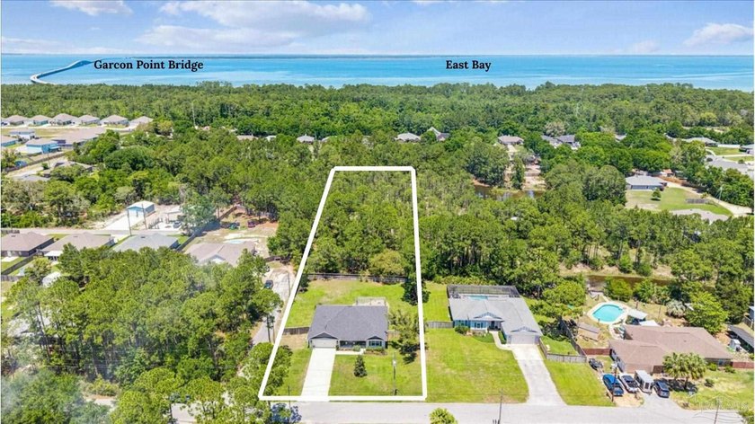 Sitting on 1.59 acres in Gulf Breeze, this 2021 custom-built - Beach Home for sale in Gulf Breeze, Florida on Beachhouse.com