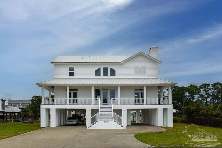 A one-of-a-kind canal-front residence just a short walk to the - Beach Home for sale in Perdido Key, Florida on Beachhouse.com