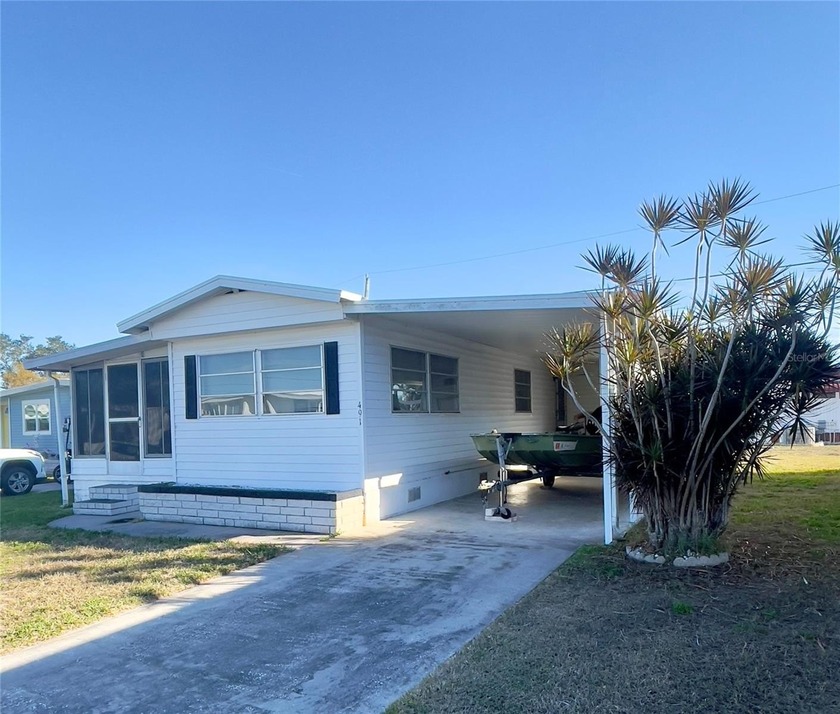 1-bedroom, 1-bath single-wide mobile home with a covered porch - Beach Home for sale in Palmetto, Florida on Beachhouse.com