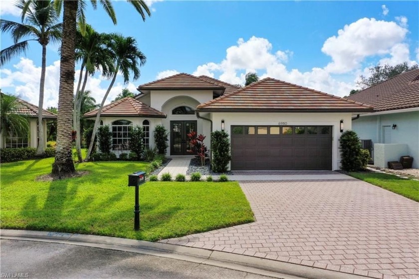 Enjoy serene lake views in this completely remodeled home in the - Beach Home for sale in Naples, Florida on Beachhouse.com