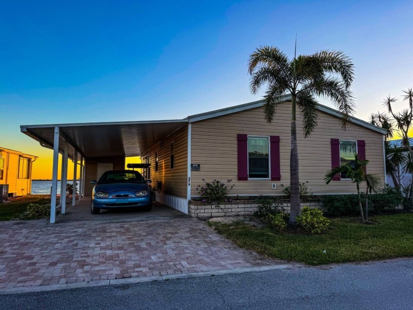 This charming 2-bedroom, 2-bath manufactured home is nestled in - Beach Home for sale in Punta Gorda, Florida on Beachhouse.com