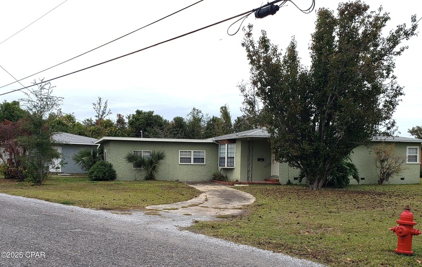 This inviting 3-bedroom, 2-bath home with a bonus room sits on a - Beach Home for sale in Lynn Haven, Florida on Beachhouse.com