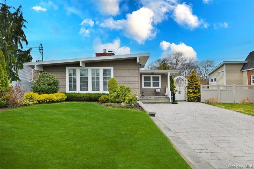 Waterfront South Amityville Gem! This meticulously maintained - Beach Home for sale in Amityville, New York on Beachhouse.com