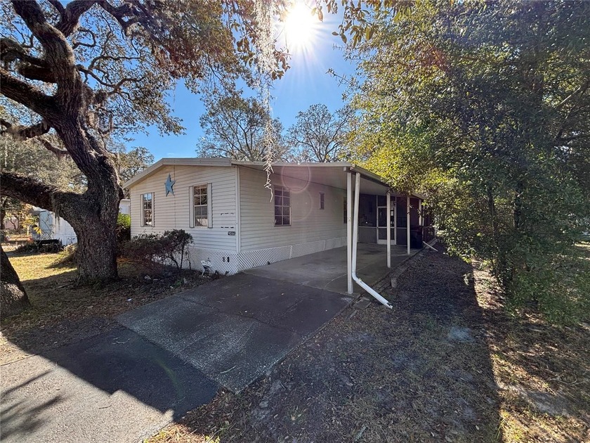 Welcome to this well-located 3-bedroom, 2-bath manufactured home - Beach Home for sale in New Port Richey, Florida on Beachhouse.com