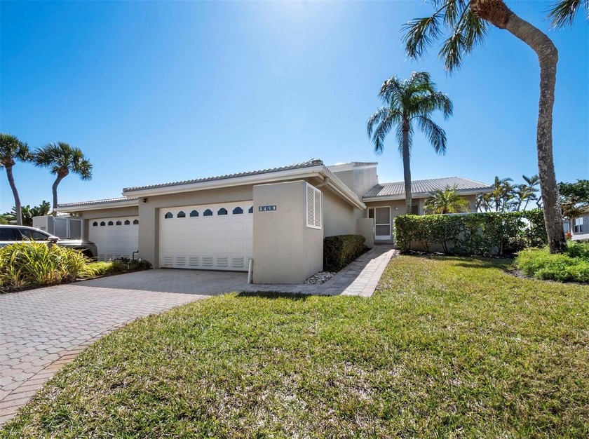 Positioned along the par-5 fairway with tranquil lake views - Beach Condo for sale in Longboat Key, Florida on Beachhouse.com