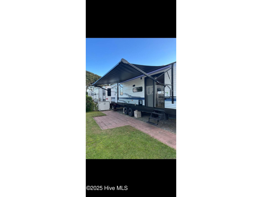 Adorable and very clean 2022 Keystone Springdale located on a - Beach Lot for sale in North Topsail Beach, North Carolina on Beachhouse.com