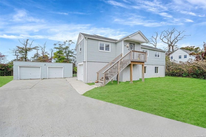 Welcome to this beautifully renovated and elevated ranch with - Beach Home for sale in Mastic Beach, New York on Beachhouse.com