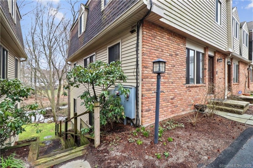 This spacious, three level end unit townhouse is tucked away for - Beach Condo for sale in Stamford, Connecticut on Beachhouse.com