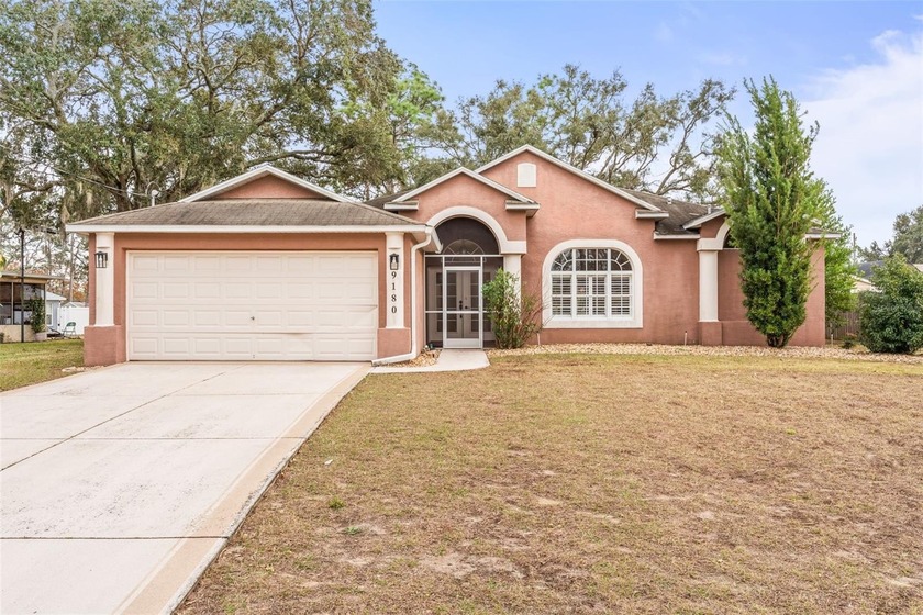 Welcome to this lovingly maintained 3-bedroom, 2-bath home with - Beach Home for sale in Spring Hill, Florida on Beachhouse.com