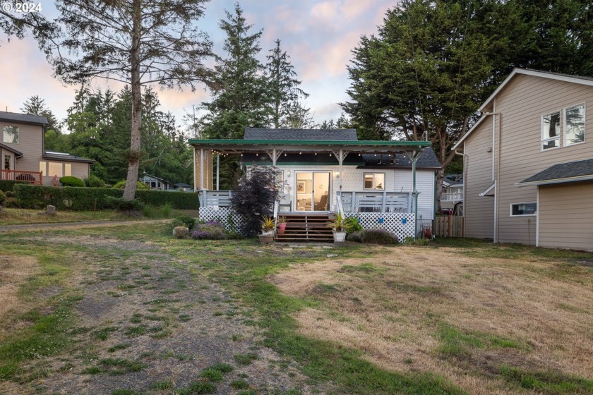 Embrace the ultimate lake lifestyle in this inviting cottage - Beach Home for sale in Lincoln City, Oregon on Beachhouse.com