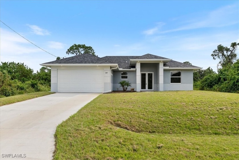 Step into this fresh, newly built home where modern design meets - Beach Home for sale in Lehigh Acres, Florida on Beachhouse.com