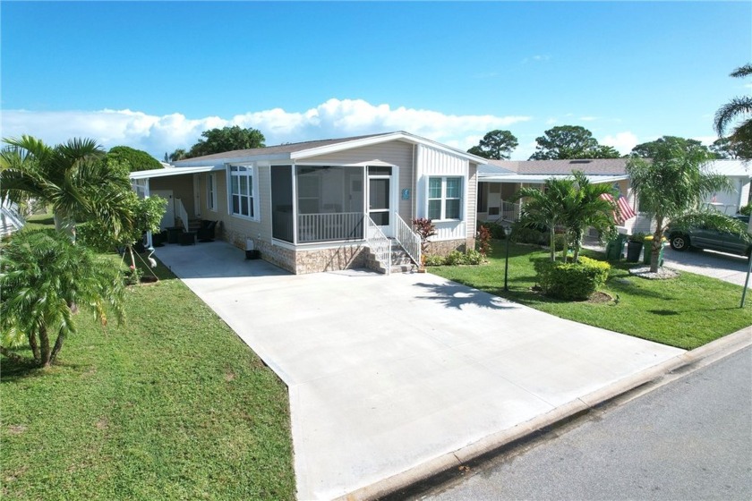 2022 Model home features accordion hurricane shutters, double - Beach Home for sale in Barefoot Bay, Florida on Beachhouse.com