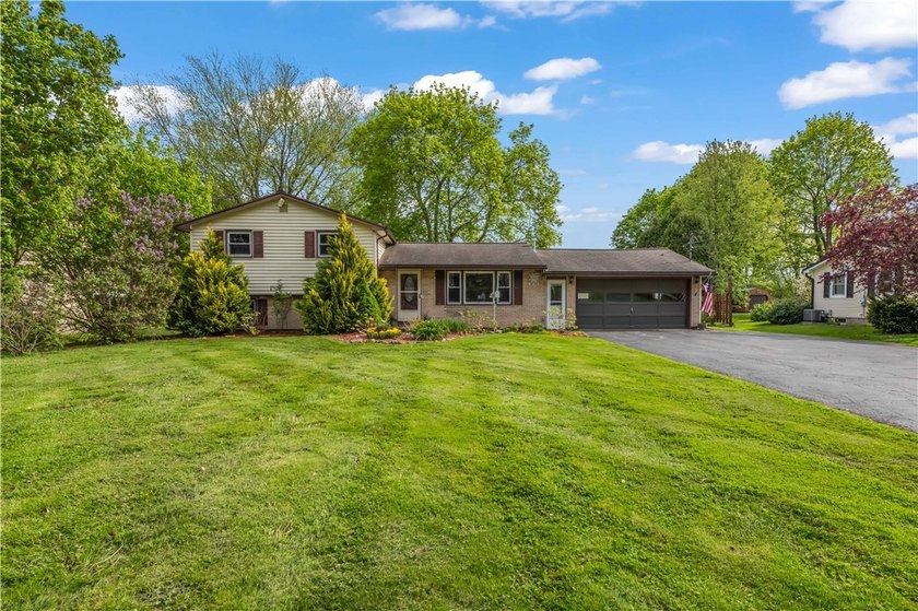 Lovingly maintained and spacious 4 bedroom, 2 full bath Split - Beach Home for sale in Hilton, New York on Beachhouse.com