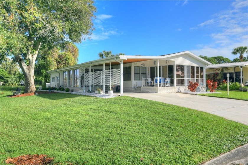 The home is situated on a generously proportioned corner lot - Beach Home for sale in Barefoot Bay, Florida on Beachhouse.com