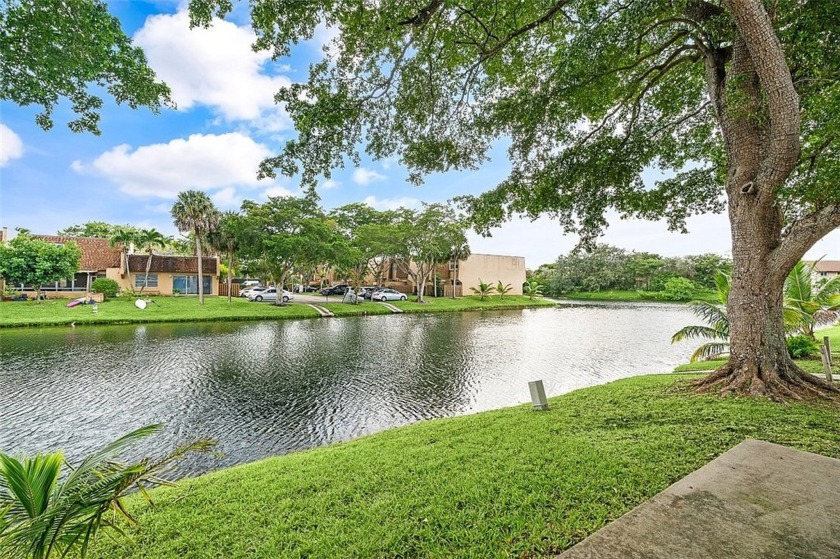 Discover serene lakefront living in this charming 2-bedroom - Beach Home for sale in Sunrise, Florida on Beachhouse.com