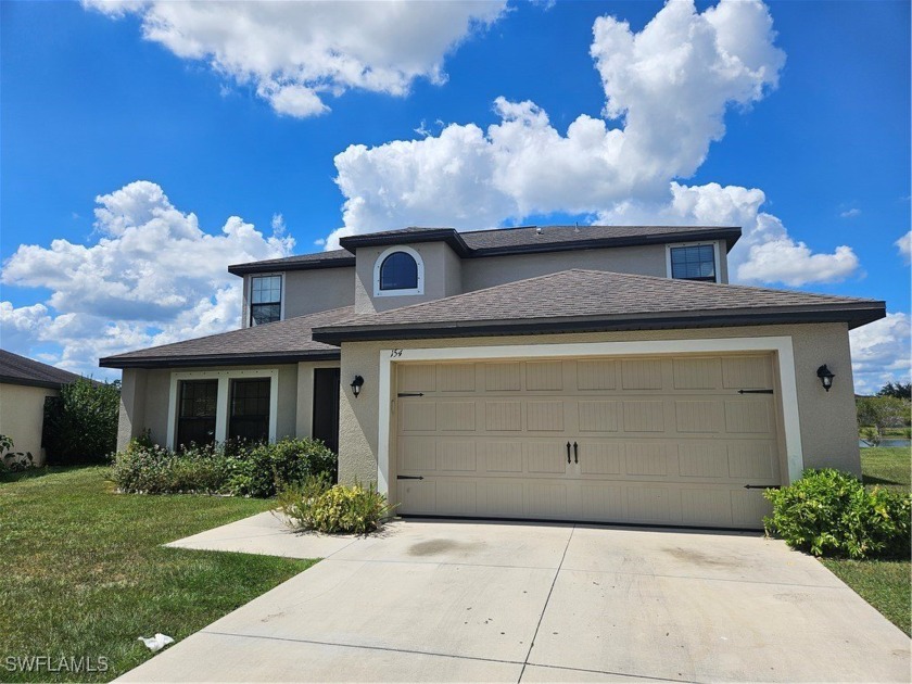 Welcome to this beautifully maintained 5 bedrooms plus den in - Beach Home for sale in Lehigh Acres, Florida on Beachhouse.com