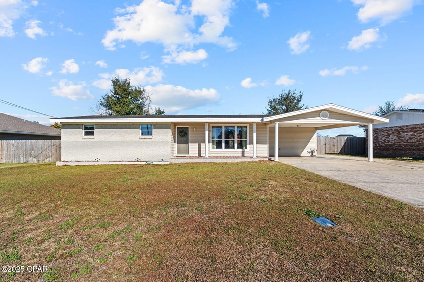This charming all-brick 3-bedroom, 2-bath home is ideally - Beach Home for sale in Panama City, Florida on Beachhouse.com