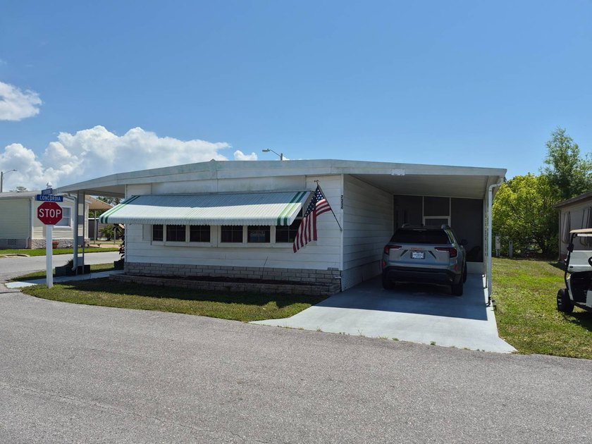 COME SEE THIS 2 BEDROOM 2 BATH HOME LOCATED IN HACIENDA VILLAGE - Beach Home for sale in New Port Richey, Florida on Beachhouse.com