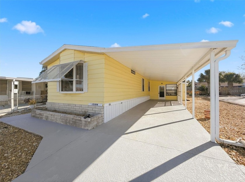 This beautifully maintained home offers an inviting open floor - Beach Home for sale in Hudson, Florida on Beachhouse.com