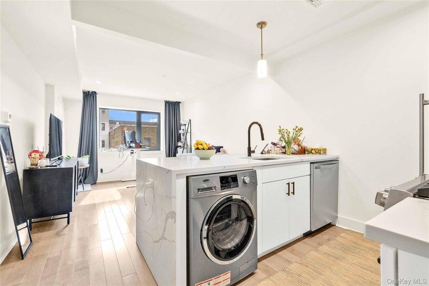 Nestled just off the vibrant energy of Broadway, this residence - Beach Condo for sale in Queens, New York on Beachhouse.com