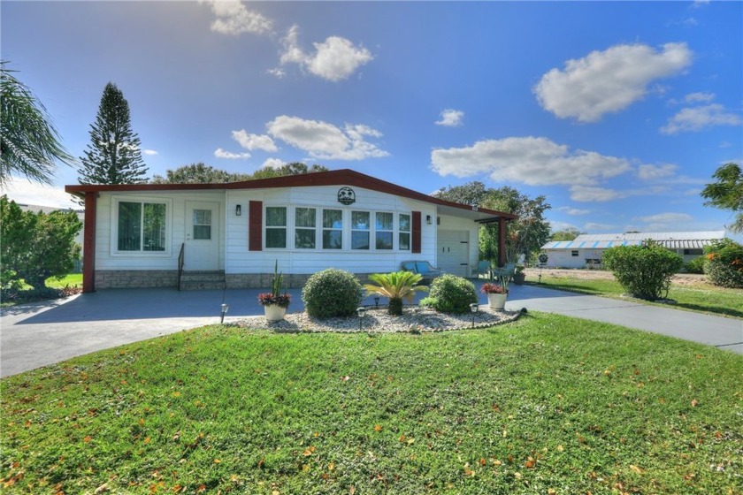 COME HOME TO BAREFOOT BAY.....One of the only garage homes on - Beach Home for sale in Barefoot Bay, Florida on Beachhouse.com