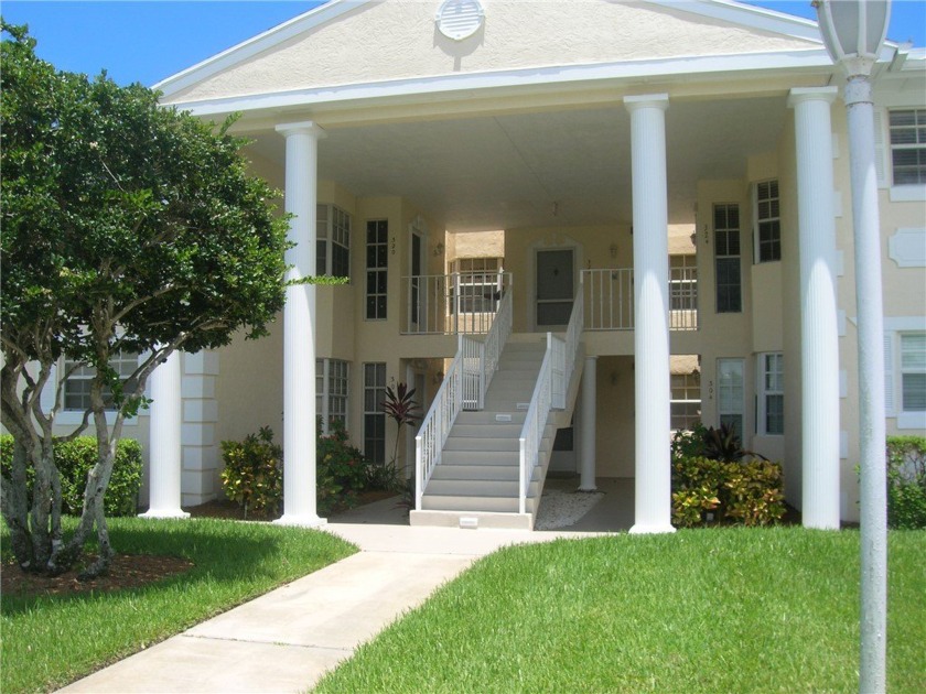 FIRST FLOOR UNIT PORCH WITH LAKE VIEW  THIS UNIT NEEDS TO BE - Beach Home for sale in Vero Beach, Florida on Beachhouse.com