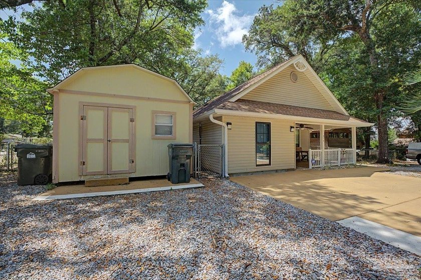 Charming 3-bedroom, 2-bath home tucked beneath a canopy of - Beach Home for sale in Pensacola, Florida on Beachhouse.com