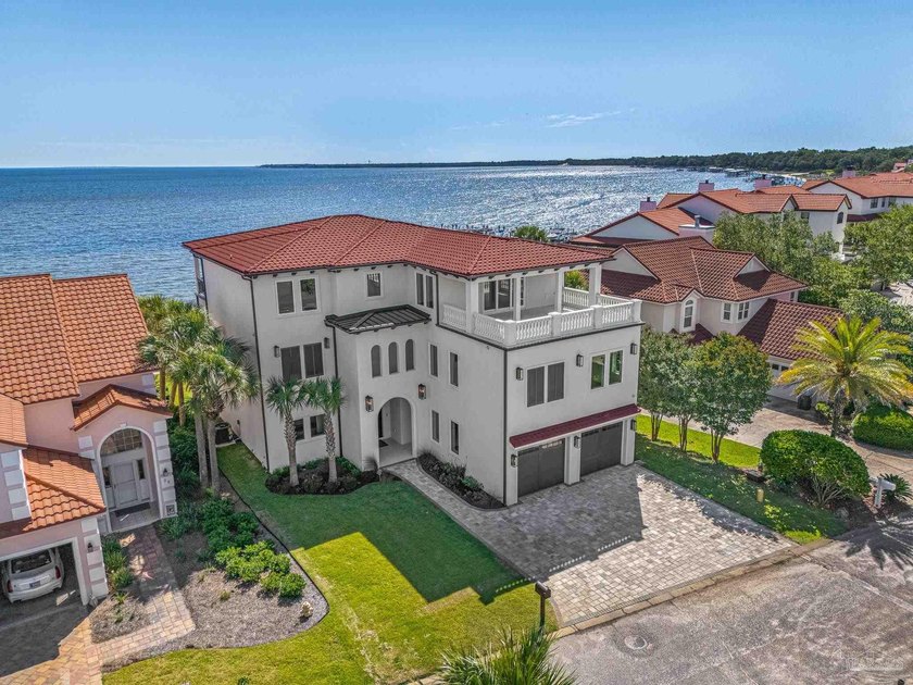 Few homes capture waterfront living like this. Behind the gates - Beach Home for sale in Gulf Breeze, Florida on Beachhouse.com