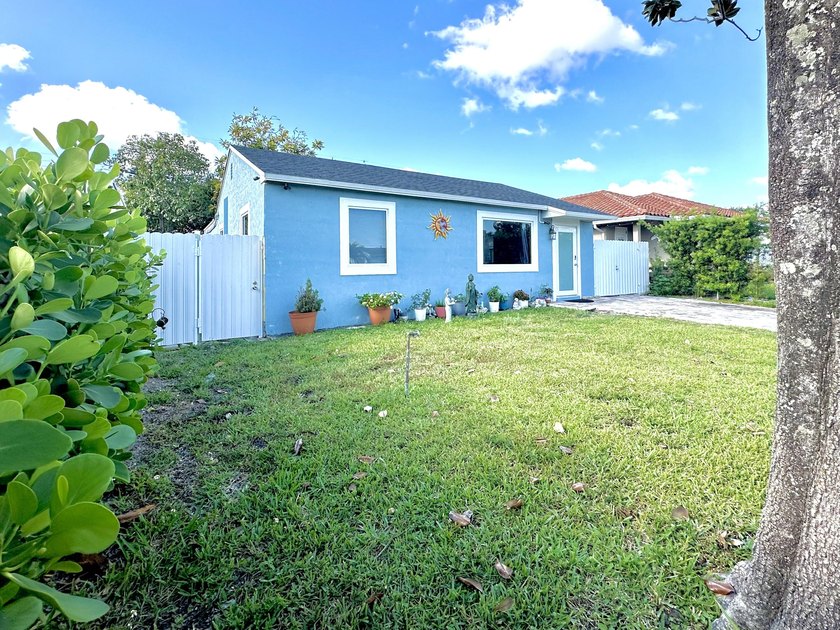 Step into this beautifully renovated 3-bedroom, 2-bathroom home - Beach Home for sale in West Palm Beach, Florida on Beachhouse.com