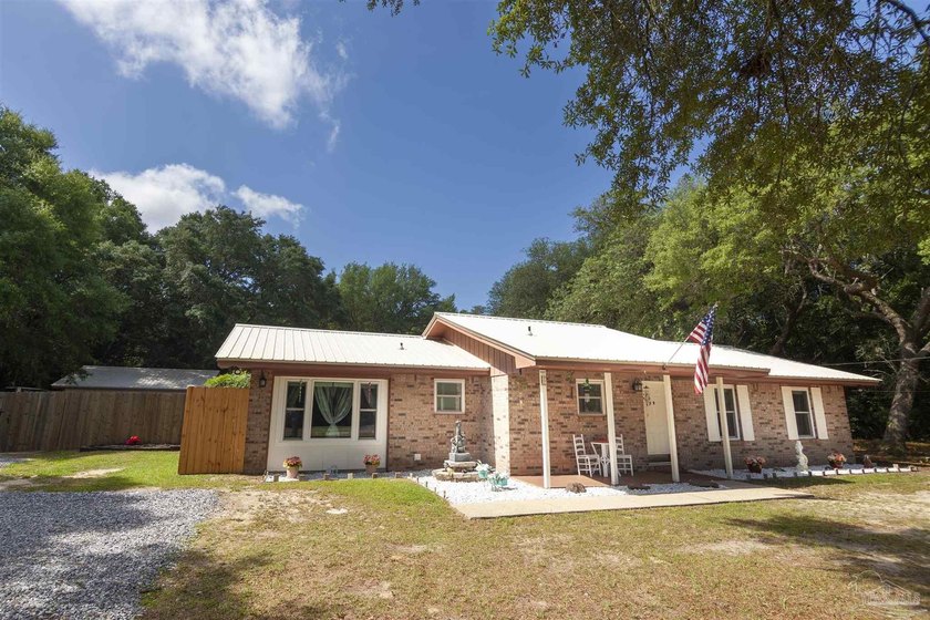 Beautiful Brick Pool Home on Nearly Acre Oak-Lined Lot with - Beach Home for sale in Milton, Florida on Beachhouse.com