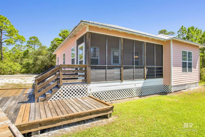Welcome to your dream coastal retreat! This fabulous cottage is - Beach Home for sale in Gulf Shores, Alabama on Beachhouse.com