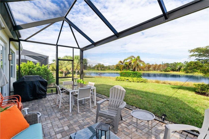 Sip your coffee and watch the LAKE from your screened in patio - Beach Home for sale in Vero Beach, Florida on Beachhouse.com