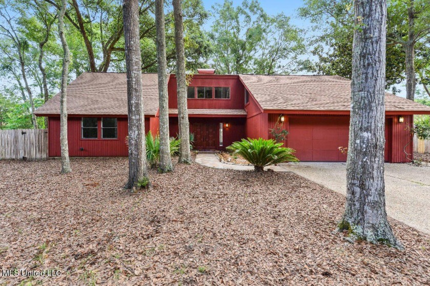 Unique renovated redwood and cedar home with wooded view in the - Beach Home for sale in Ocean Springs, Mississippi on Beachhouse.com